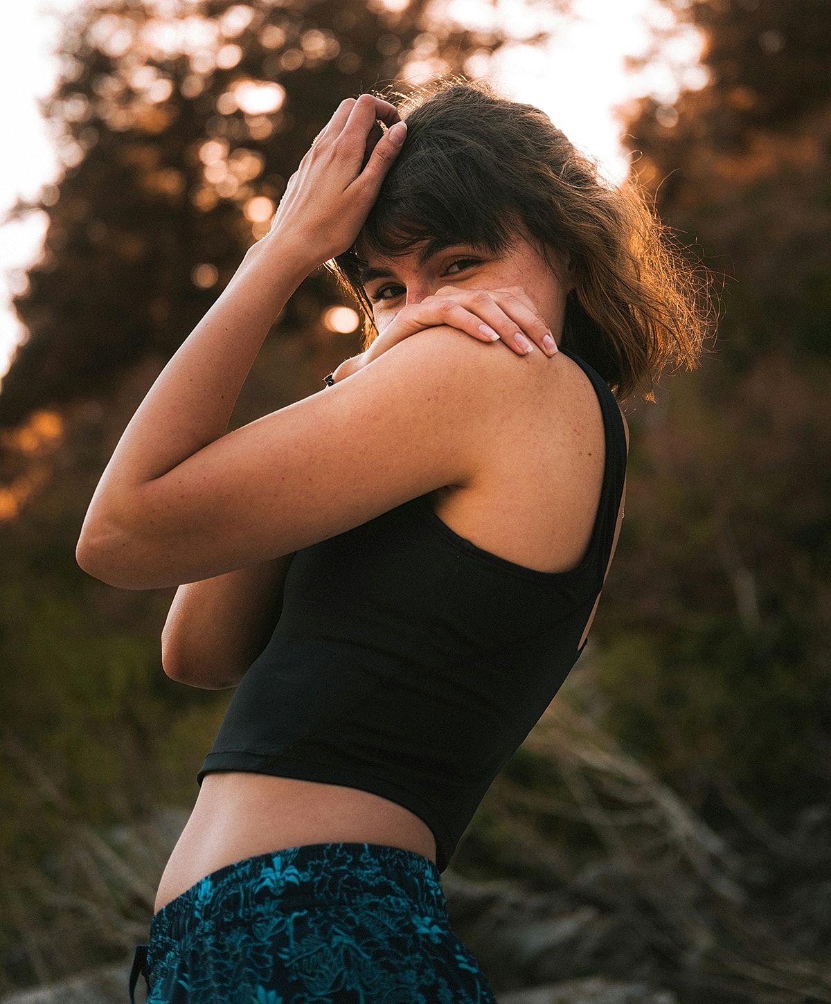 Wasilla Body Contouring model posing outdoors during sunset.