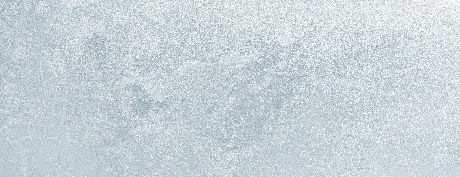 Man in winter hat against snowy background.